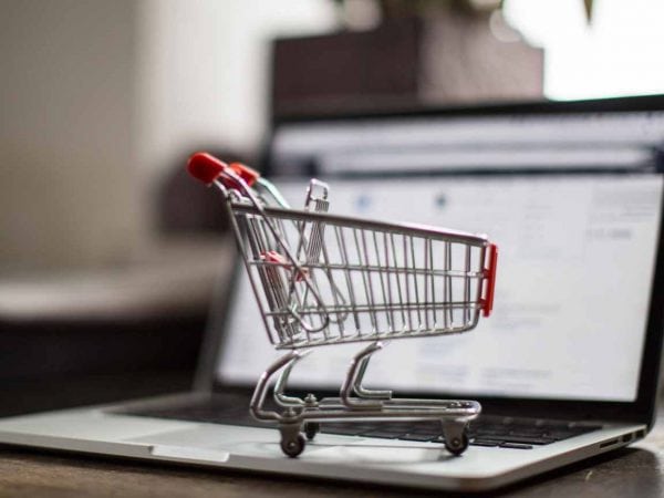 A Shopping Cart On a Laptop Showing E-Commerce Stores-Cedric Millar Canada Supply Chain Logistics Company