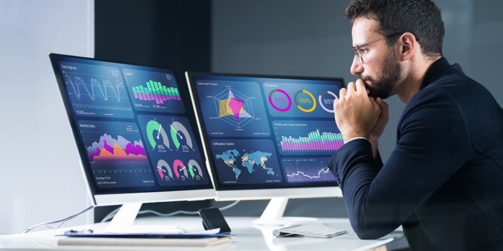 person looking at business intelligence charts on a computer